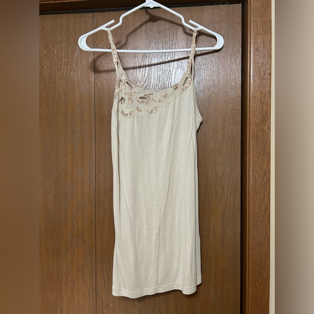 Glitter and cream colored tank
